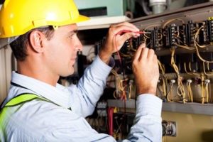 Electrician working on a panel