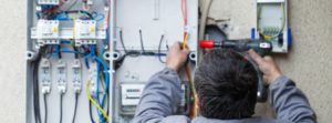 electrician repairing a panel.